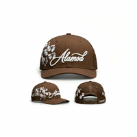 Alamòd Archives Orijin trucker hat with mesh back and embroidered front panel, casual cap with adjustable strap.