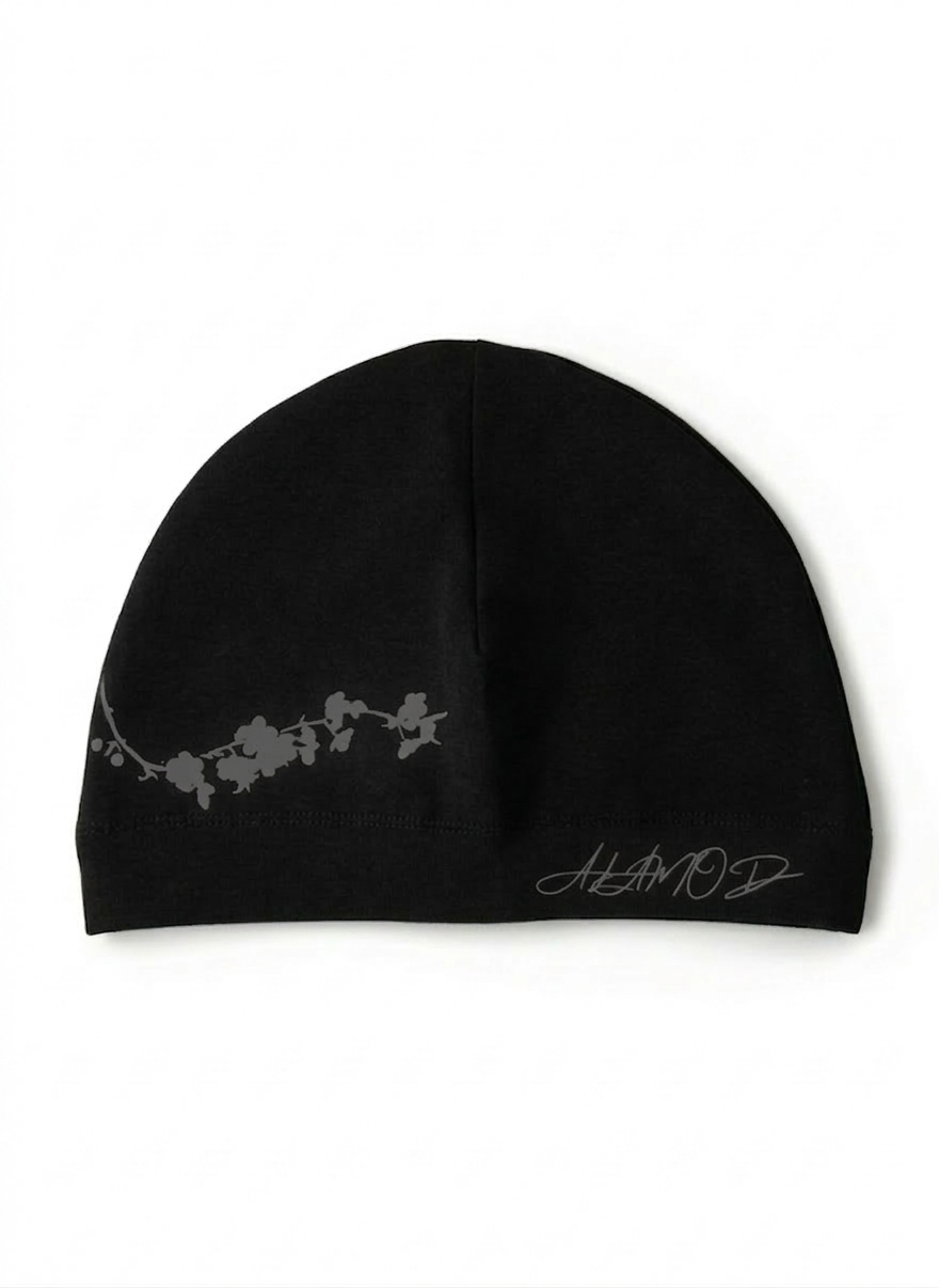 Black skull cap by Alamòd, Orijin, featuring a sleek design with a snug fit, suitable for casual wear or sports.