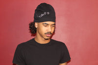 Alamòd Orijin Black Skull Cap worn on a person's head, featuring a sleek, fitted design for casual or athletic wear.