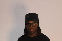 Alamòd Orijin Black Skull Cap featuring a sleek black design and comfortable fit, ideal for casual or athletic wear.